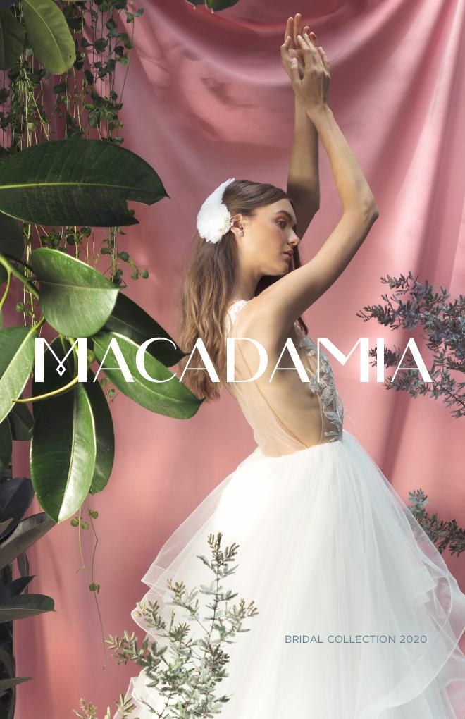 Macadamia bridal couture against pink drapery and foliage